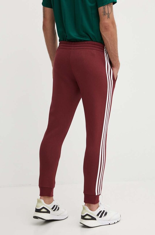 Odzież adidas spodnie dresowe Essentials JG5951 bordowy