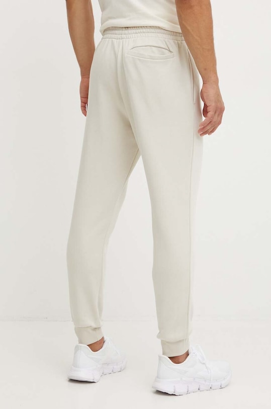 Odzież adidas spodnie dresowe Essentials JH1039 beżowy