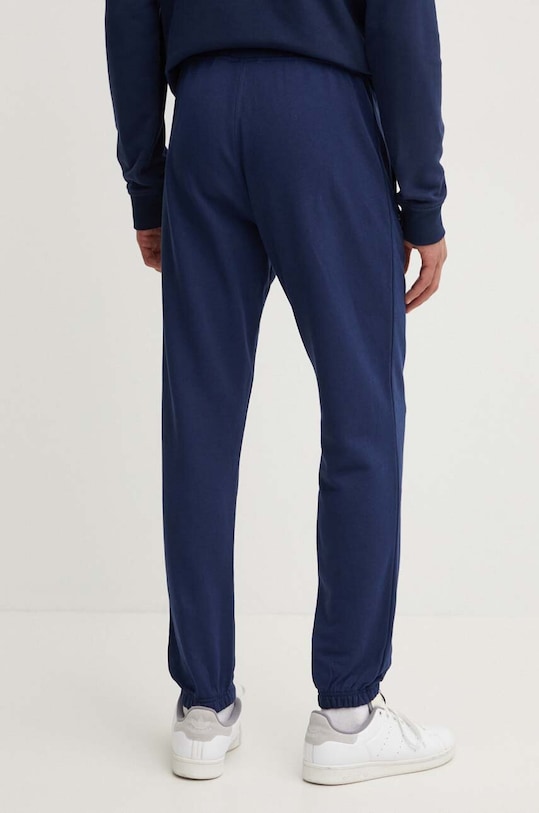 Oblečenie Bavlnené tepláky adidas Originals IX7689 tmavomodrá