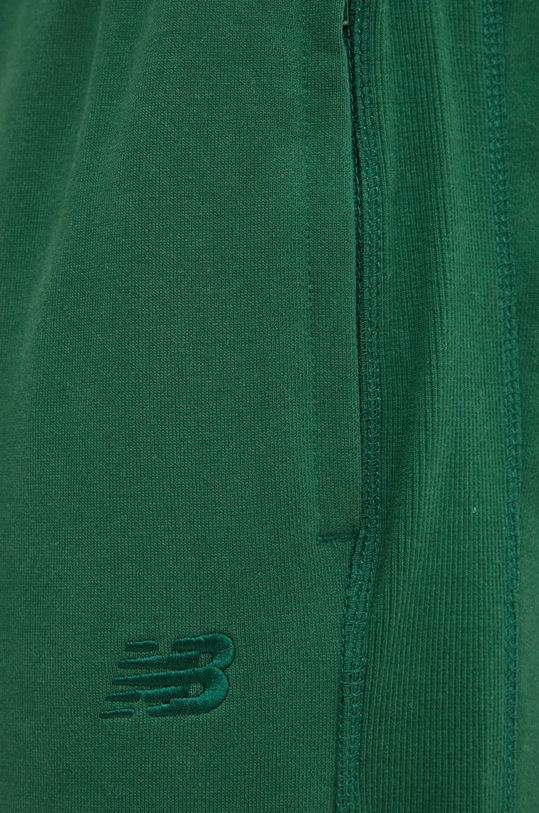 New Balance spodnie dresowe bawełniane zielony MP41508NWG