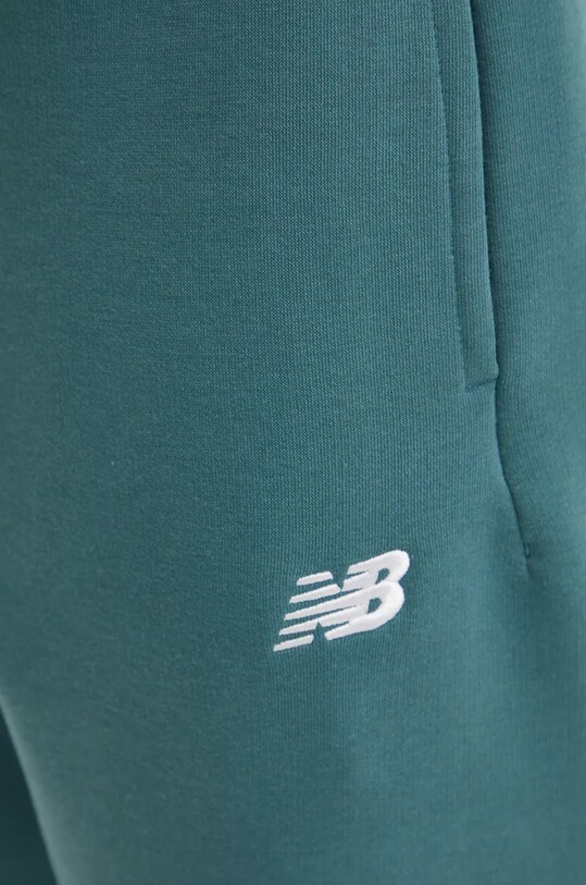 New Balance spodnie dresowe zielony MP41503NUS