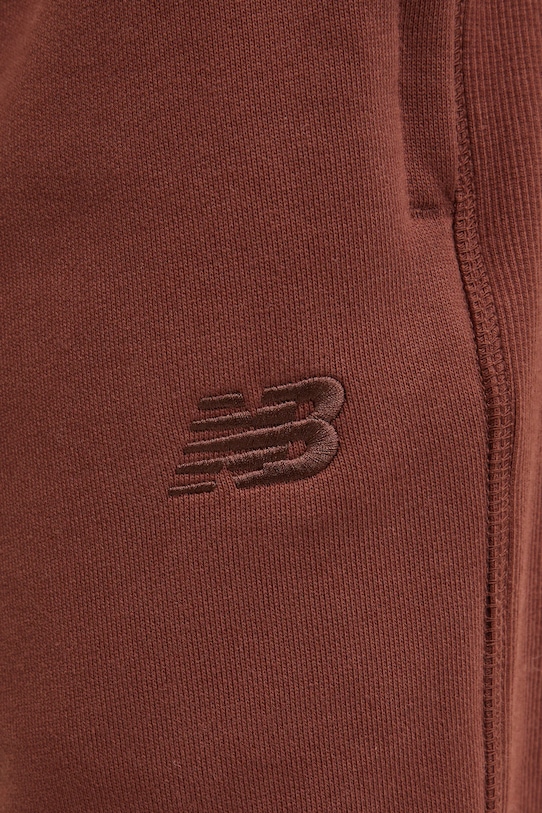 Bavlněné tepláky New Balance hnědá MP41508ROK
