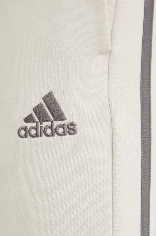 Tepláky adidas Essentials béžová JG5952