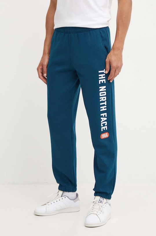Tepláky The North Face Pant Varsity Graphic pletenina tyrkysová NF0A89DP1NO1