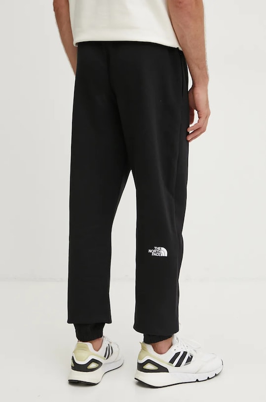 Oblečenie Bavlnené tepláky The North Face Essential NF0A8A6JJK31 čierna