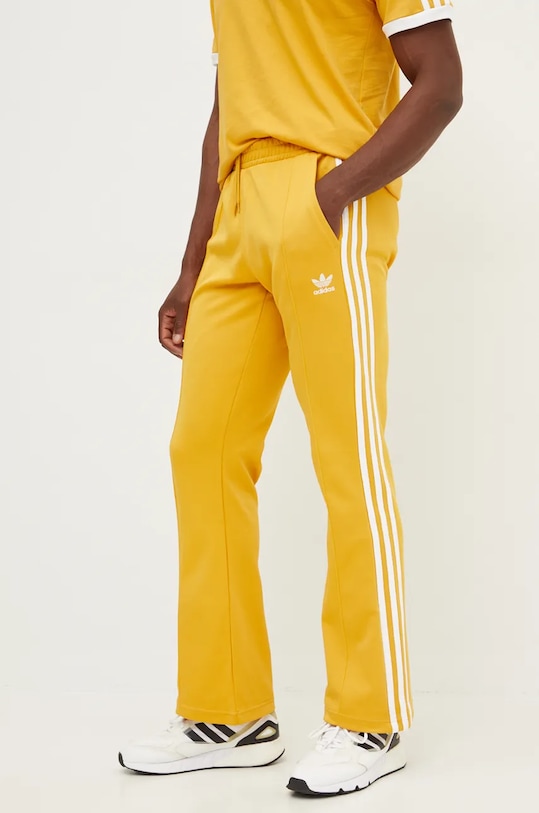 Tepláky adidas Originals 70S Track Pant pletenina žlutá IX5223