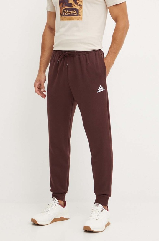 adidas spodnie dresowe Essentials dzianina brązowy IY9086