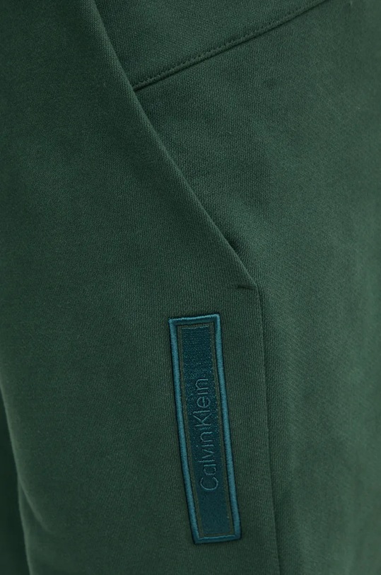 Calvin Klein spodnie dresowe bawełniane zielony K10K113579