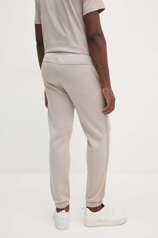 Îmbrăcăminte Calvin Klein Jeans pantaloni de trening J30J326175 bej