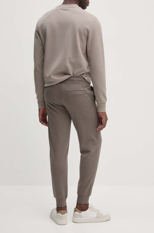 Odzież Calvin Klein Jeans spodnie dresowe bawełniane J30J326886 beżowy