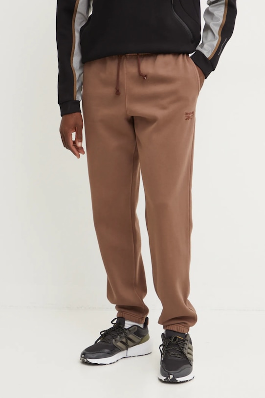 Reebok spodnie dresowe Identity Washed dzianina brązowy 100205487