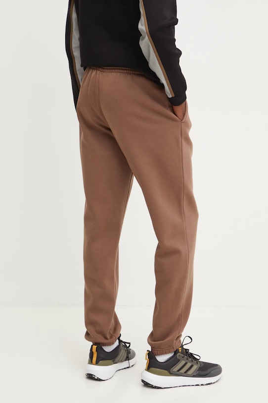 Odzież Reebok spodnie dresowe Identity Washed 100205487 brązowy