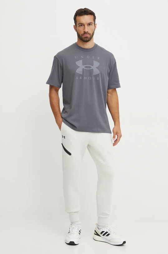 Spodnji del trenirke Under Armour Unstoppable Fleece 1389353 bež AW24