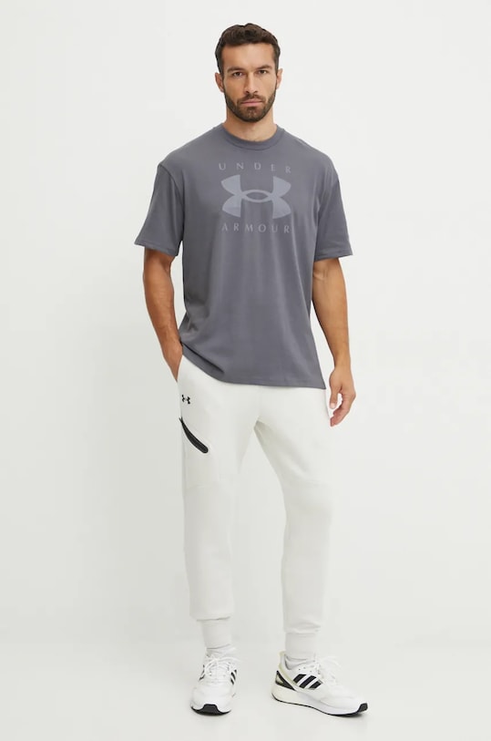 Spodnji del trenirke Under Armour Unstoppable Fleece 1389353 bež AW25