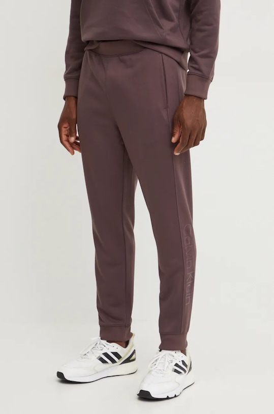 Tréninkové kalhoty Calvin Klein Performance pletenina hnědá 00GMF4P602