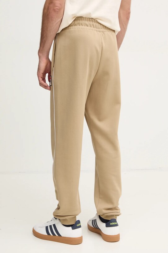 Odzież Fila spodnie dresowe Lincoln FAM0663 beżowy
