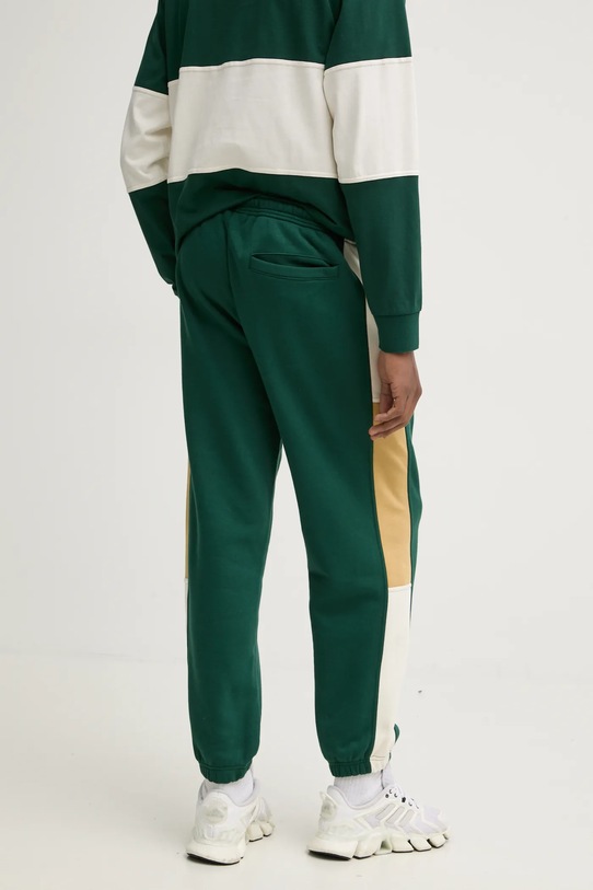 Abbigliamento Converse pantaloni della tuta 10027594.A01 verde