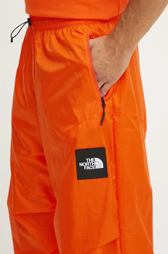 Nohavice The North Face TNF x Yinka Ilori oranžová NF0A89GPA6M1
