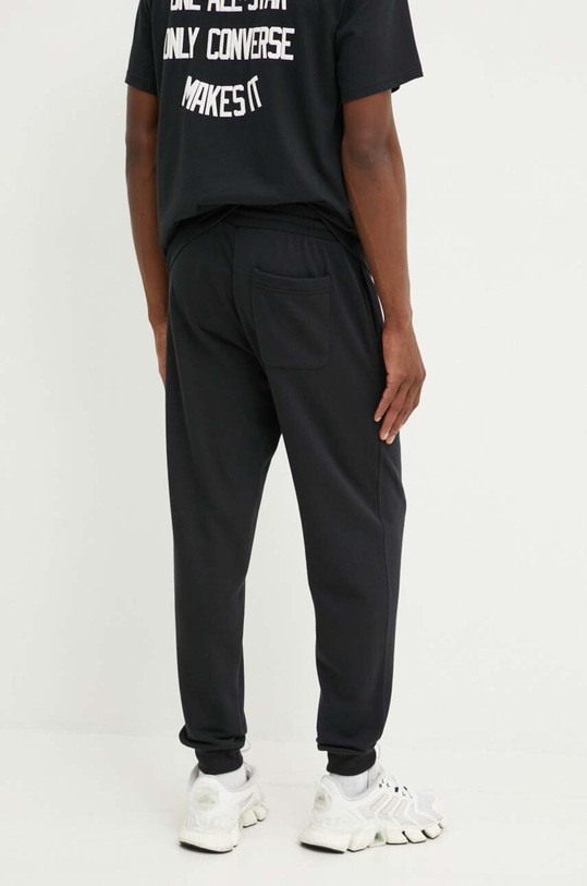 Odzież Converse spodnie dresowe 10026982.A01 czarny