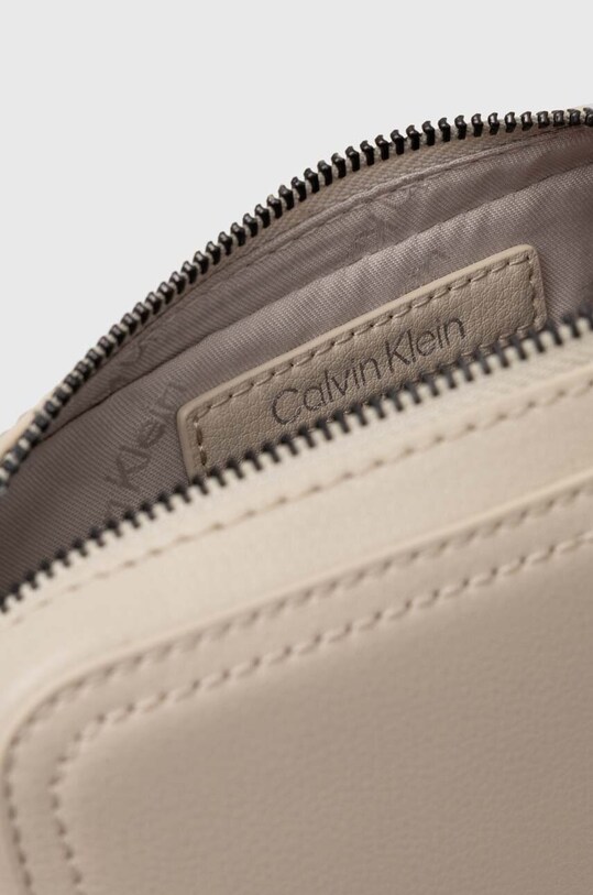 Malá taška Calvin Klein béžová K50K511850
