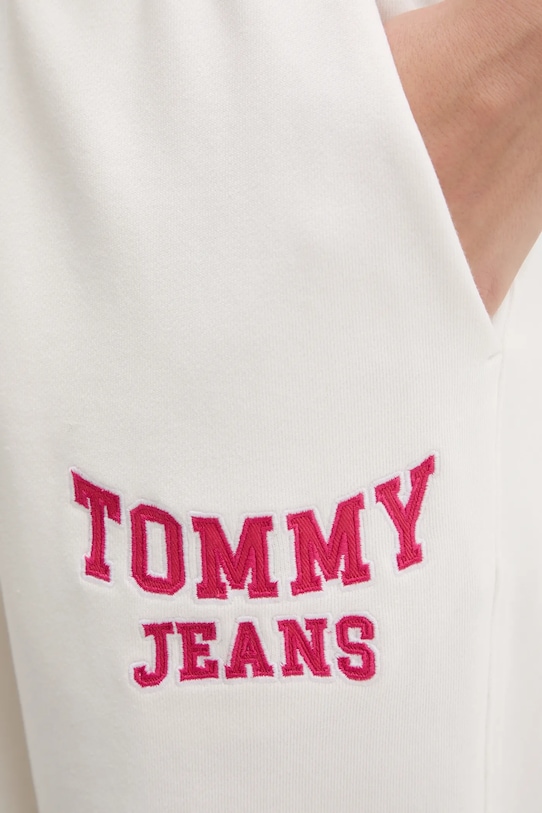 Бавовняні спортивні штани Tommy Jeans бежевий DW0DW22164