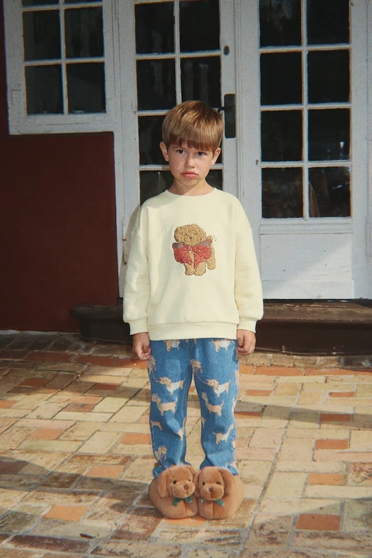 Konges Sløjd kapcie dziecięce SAUSAGE DOG FOOTIES KS105189.9BYA