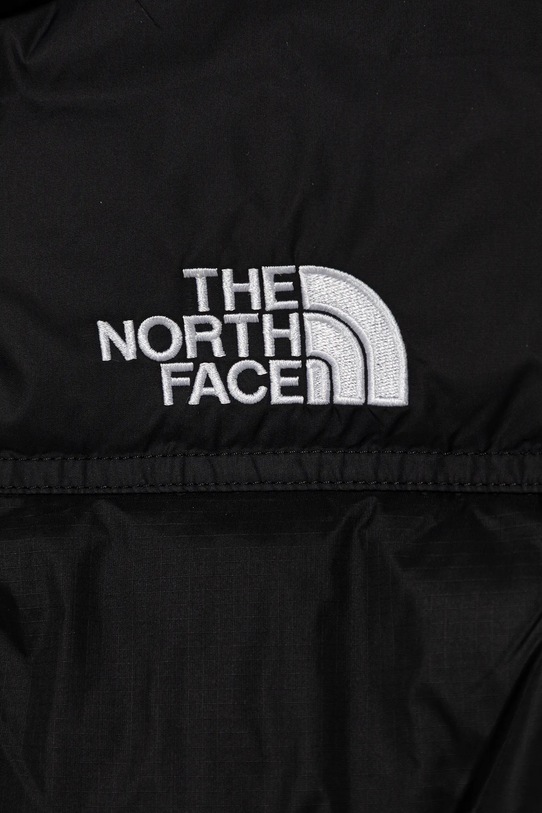 Chłopiec The North Face bezrękawnik puchowy dziecięcy TEEN 1996 RETRO NUPTSE VEST NF0A8A4BGOG1 czarny