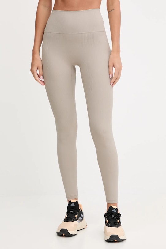 New Balance legginsy treningowe z elastanem beżowy WP53152ADS
