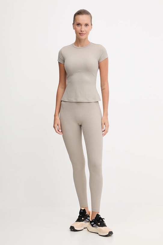 New Balance legginsy treningowe WP53152ADS beżowy AW25