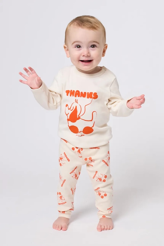 Bobo Choses legginsy niemowlęce Rolling Dog beżowy 225FB010