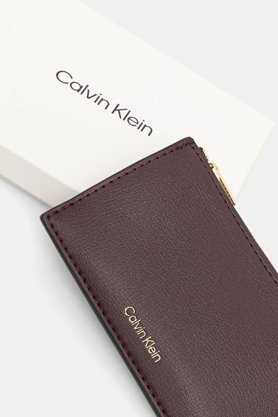 Akcesoria Calvin Klein portfel LV04F1090G fioletowy