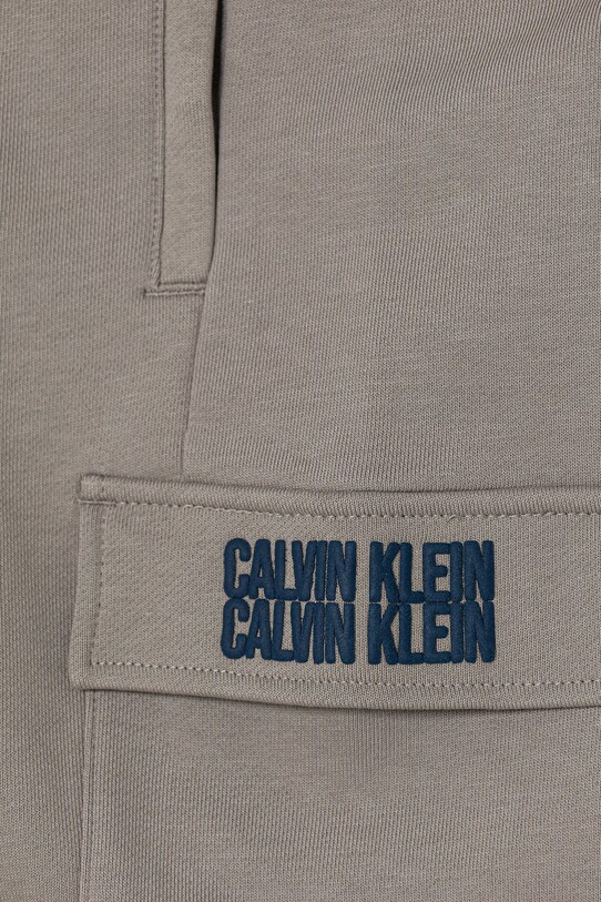 Chłopiec Calvin Klein Jeans spodnie dresowe bawełniane dziecięce TERRY IB0IB02522.9BYA szary