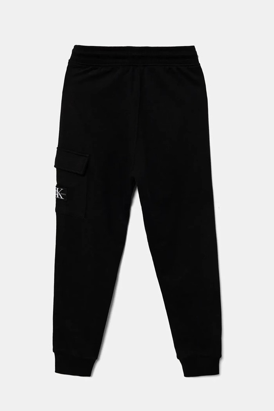 Дитячі бавовняні штани Calvin Klein Jeans IB0IB02199.9BYA чорний AW25