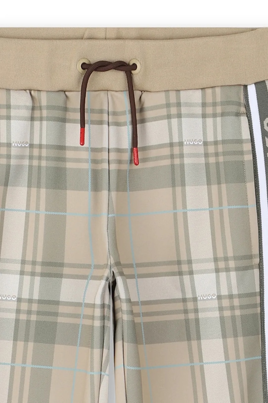 HUGO spodnie dresowe dziecięce beżowy G00463.114.150