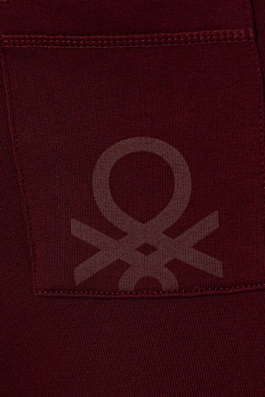 Chłopiec United Colors of Benetton spodnie dresowe bawełniane dziecięce 3J68CF058.G.Season.9BYA bordowy