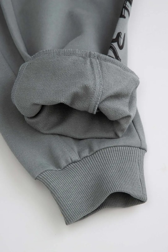 Дитячі бавовняні штани Coccodrillo сірий ZC5120102SBK