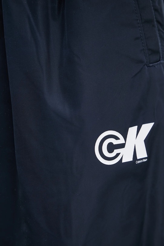 Tepláky Calvin Klein Jeans námořnická modř LV047C627G