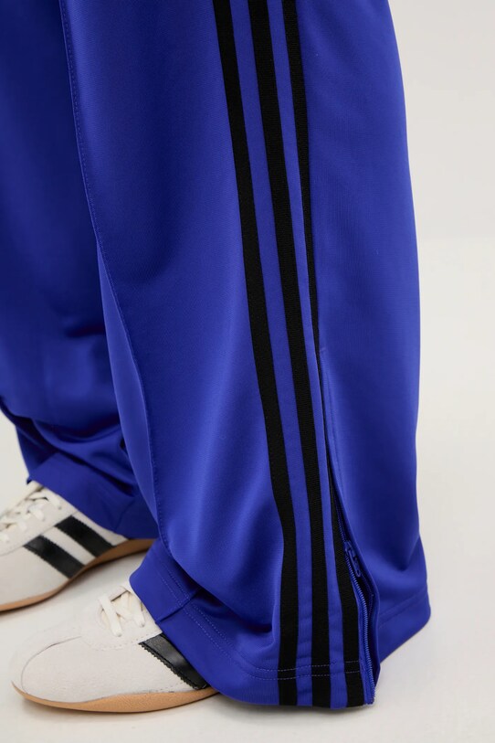Tepláky adidas Originals Firebird modrá JY2693