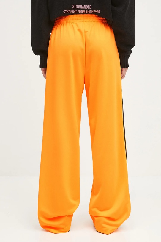 Odzież adidas Originals spodnie dresowe Firebird JY2694 pomarańczowy