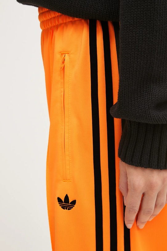adidas Originals spodnie dresowe Firebird pomarańczowy JY2694