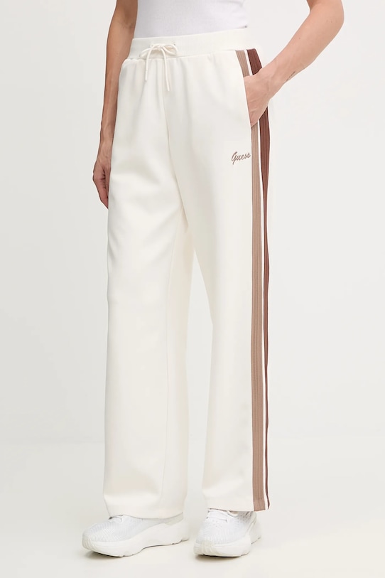 Спортивні штани Guess FABIA аплікація бежевий V5BB24.KCX22