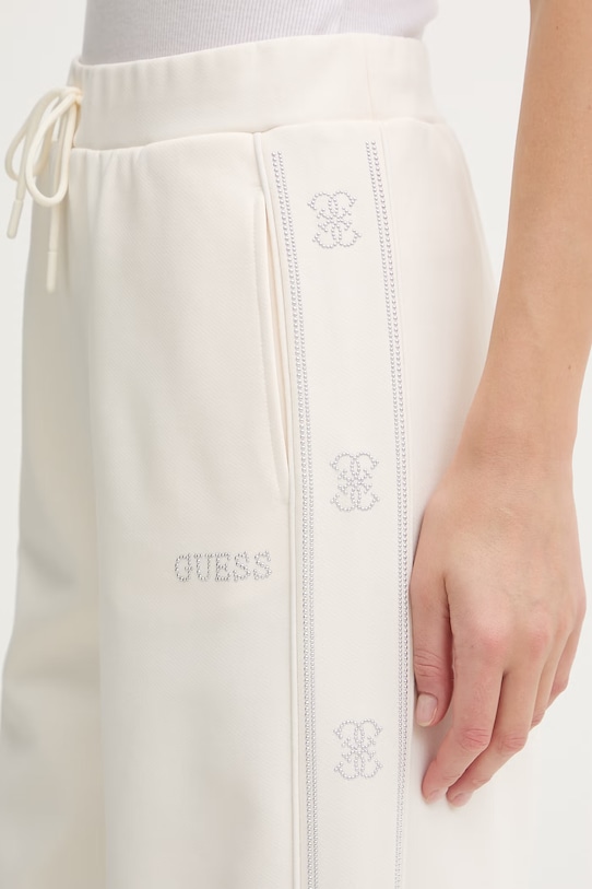 Guess spodnie dresowe OCTAVIA beżowy V5BB12.KCX22