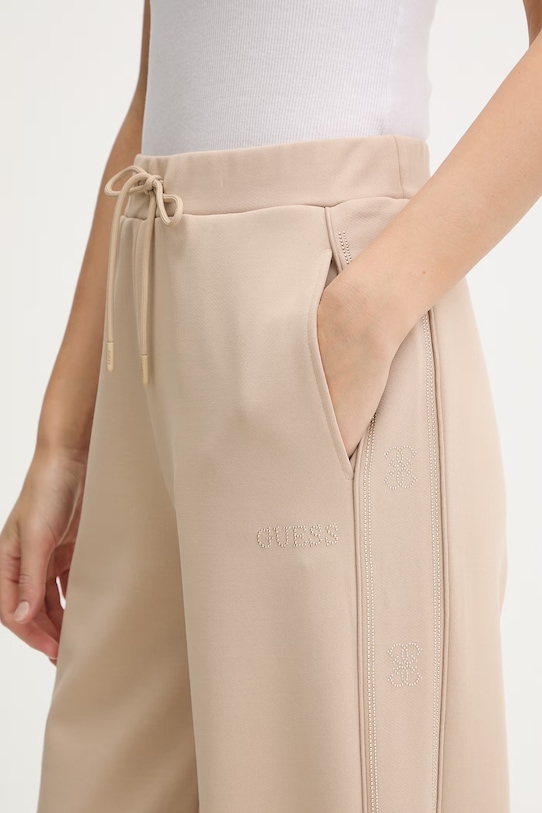 Guess spodnie dresowe OCTAVIA beżowy V5BB12.KCX22