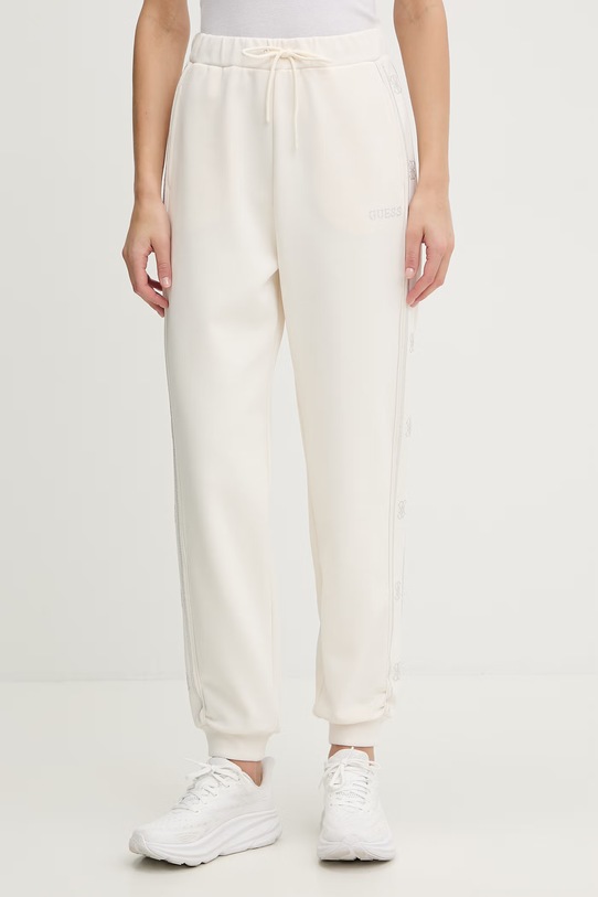 Guess spodnie dresowe OCTAVIA aplikacja beżowy V5BB23.KCX22