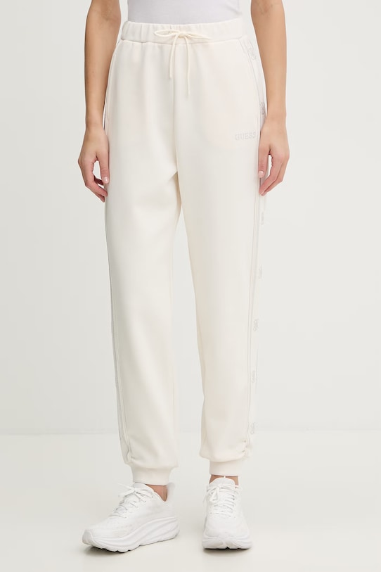 Guess spodnie dresowe OCTAVIA aplikacja beżowy V5BB23.KCX22