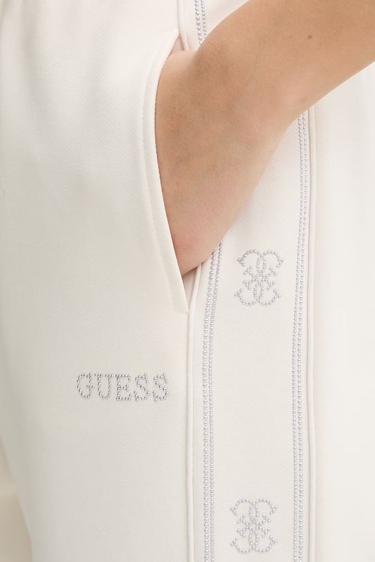 Guess spodnie dresowe OCTAVIA beżowy V5BB23.KCX22