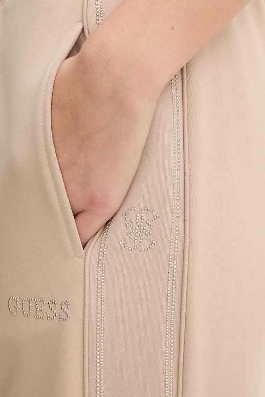 Guess spodnie dresowe OCTAVIA beżowy V5BB23.KCX22