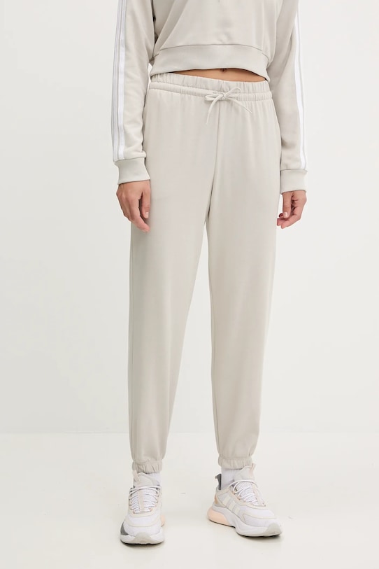 adidas spodnie dresowe Essentials beżowy JC8305