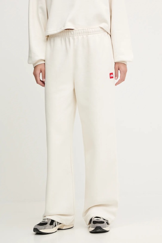 The North Face spodnie dresowe Redbox aplikacja beżowy NF0A8EG2QLI1