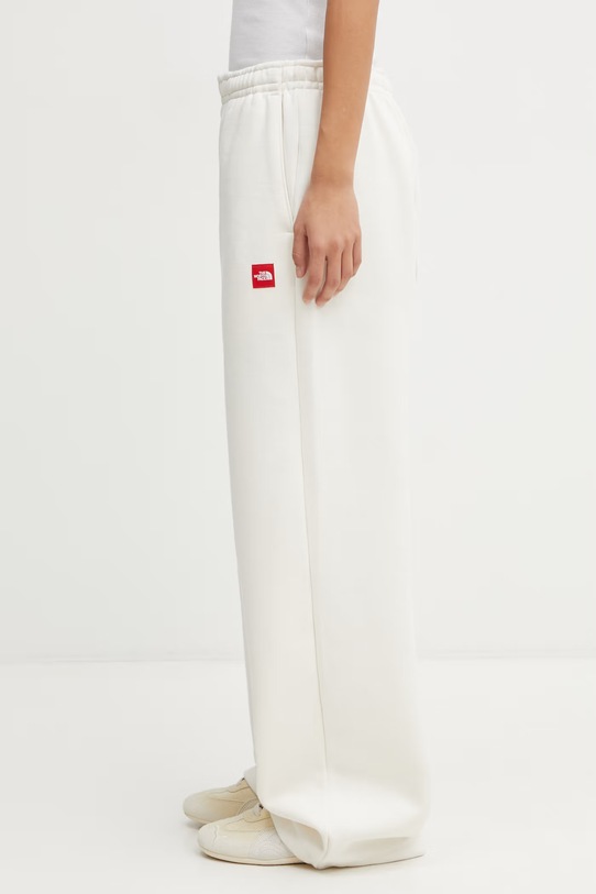 The North Face spodnie dresowe Redbox NF0A8EG2QLI1 beżowy AW25